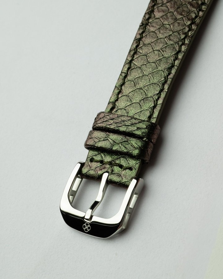 The scales on the marine leather straps, made by Ictyos from upcycled salmon skin, add to the reptilian feel of these two 50-piece limited editions.