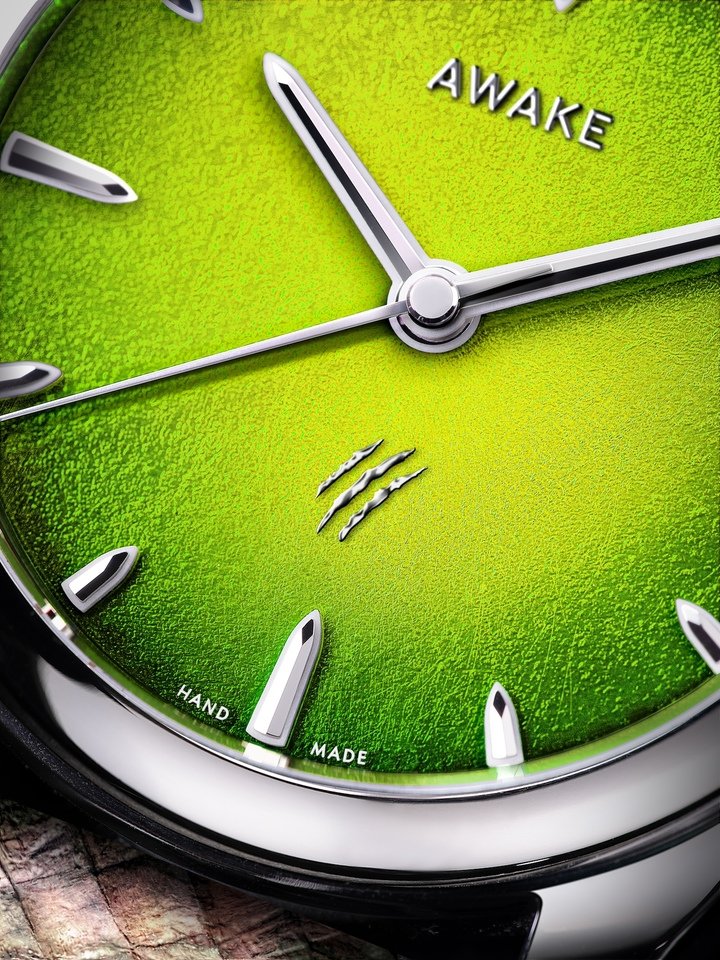 Close-up of the T-Rex and Raptor dials, “signed” with double and triple slash marks. Hands and indexes are wrapped in blue Super-LumiNova for contrast.