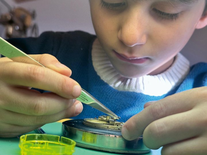 The next generation: Antoine and May's grandsons, Evan and Sohan, age 5 and already at the workbench.