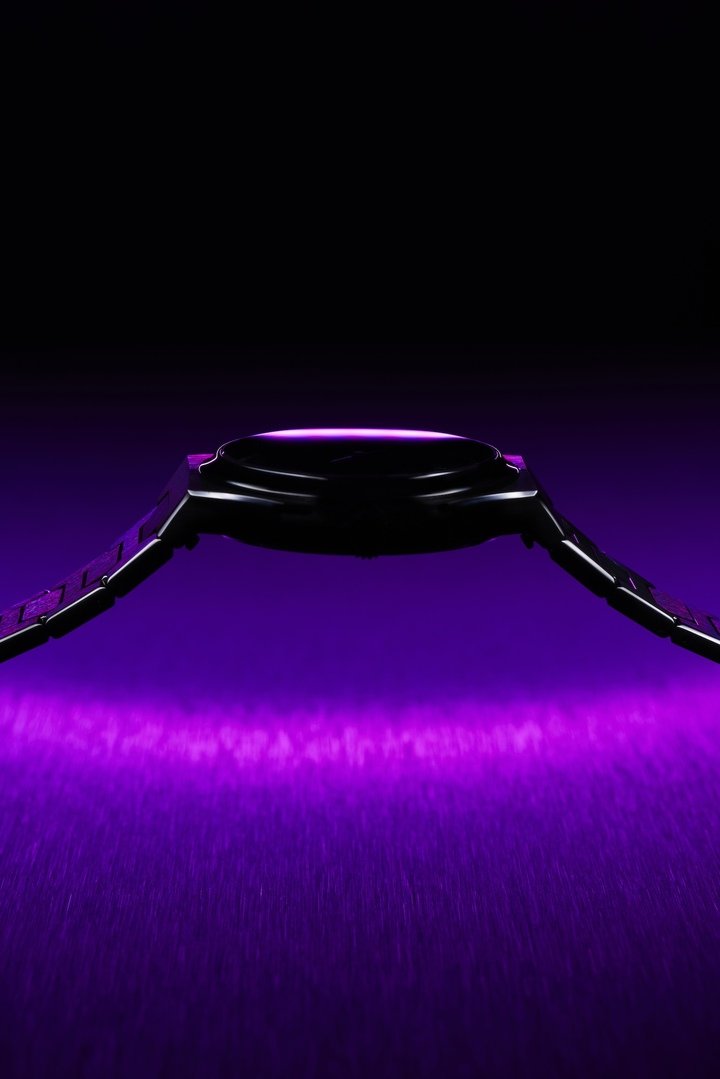 The purple of the dial is complemented by the darker shades of the grade 5 titanium case and bracelet.